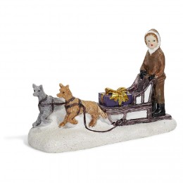 Sujet de Noël personnage sur traineau avec chien en résine